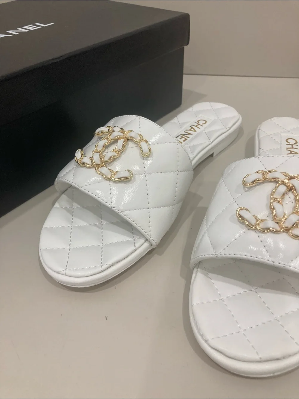 CHANEL White Quilted Slide Mules with Gold CC Chain Logo
